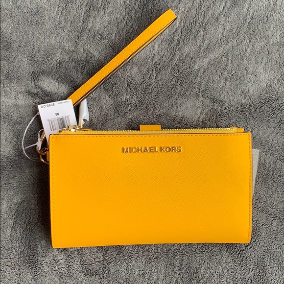 Michael Kors Handbags - NWT Michael Kors double zip wristlet